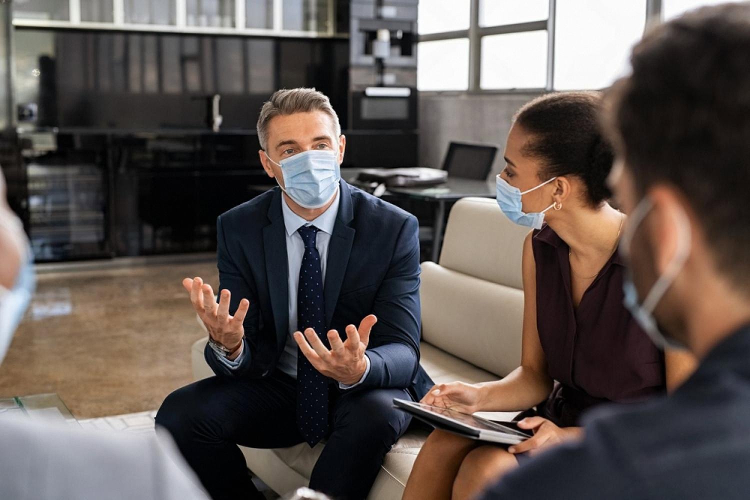 UAE executives in a boardroom crisis meeting discussing business resilience planning